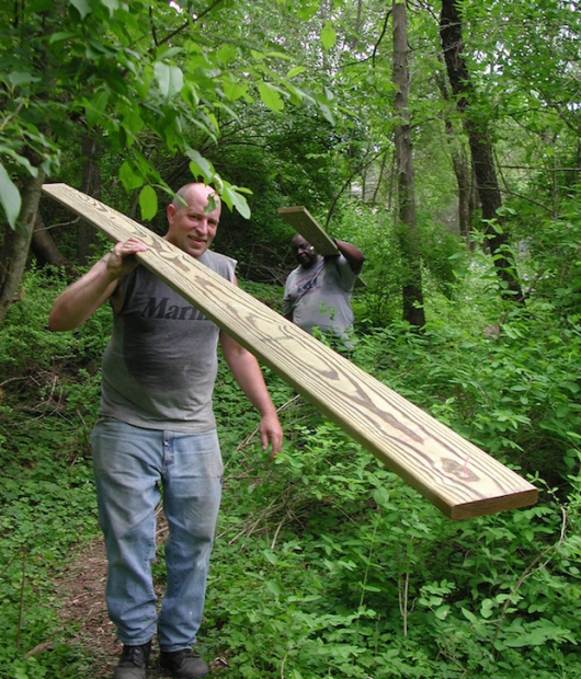 Swamp-Hut-carrying-in-materials