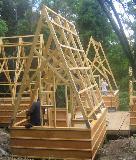 Swamp-Hut-construction-staining-the-wood